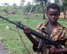  A 2000 image of a 14-year-old soldier in Sierra Leone Photograph: Adam Butler/AP 