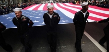 NEW YORK, NY - NOVEMBER 11: Members of the U.S. Navy march with the American Flag in the the nation's largest Veterans Day Parade in New York City on November 11, 2015 in New York City. Known as "America's Parade" it features over 20,000 participants, including veterans of numerous eras, military units, businesses and high school bands and civic and youth groups. (Photo by Spencer Platt/Getty Images) (Credit: Getty Images / Spencer Platt)
